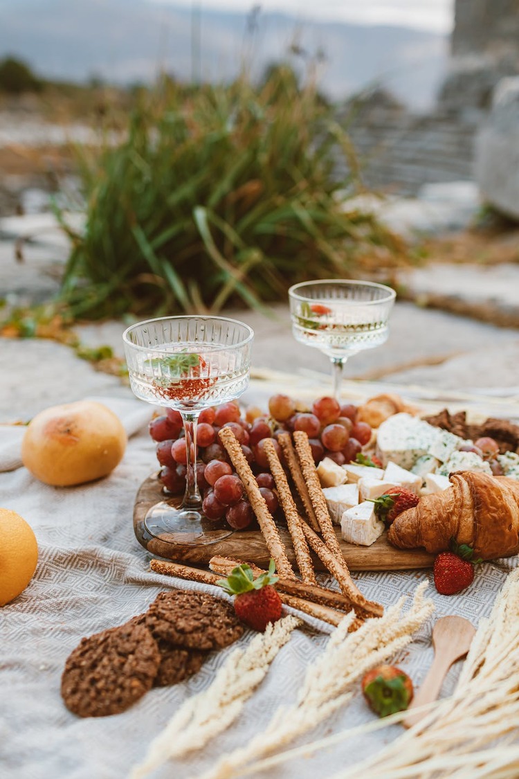 Picnic Spread with Sparkling Wine, Blue Cheese, Camembert, Grapes and Croissant